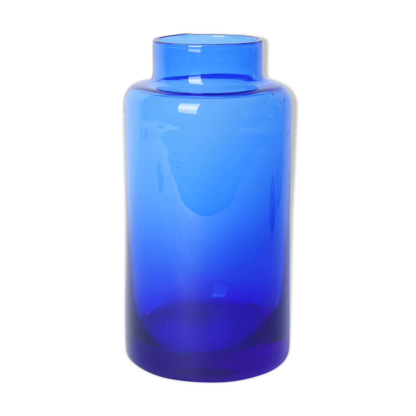 Lighter blue glass vase at the top