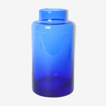 Lighter blue glass vase at the top