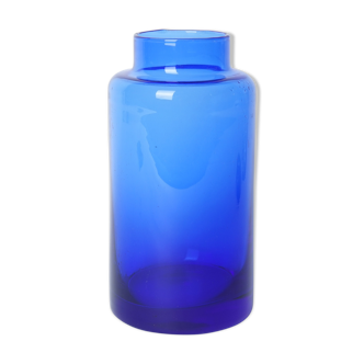 Lighter blue glass vase at the top