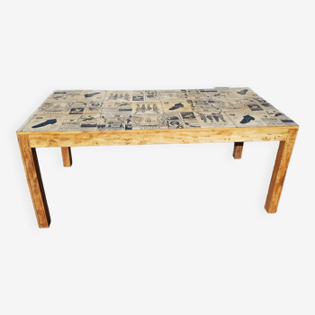 Teak dining table with illustrated top