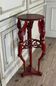 Athenian carved wood, red patina imitation of red marble