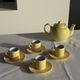 Set of 4 vintage yellow Italian espresso cups and saucers.