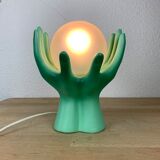 Green ceramic hand lamp and glass globe