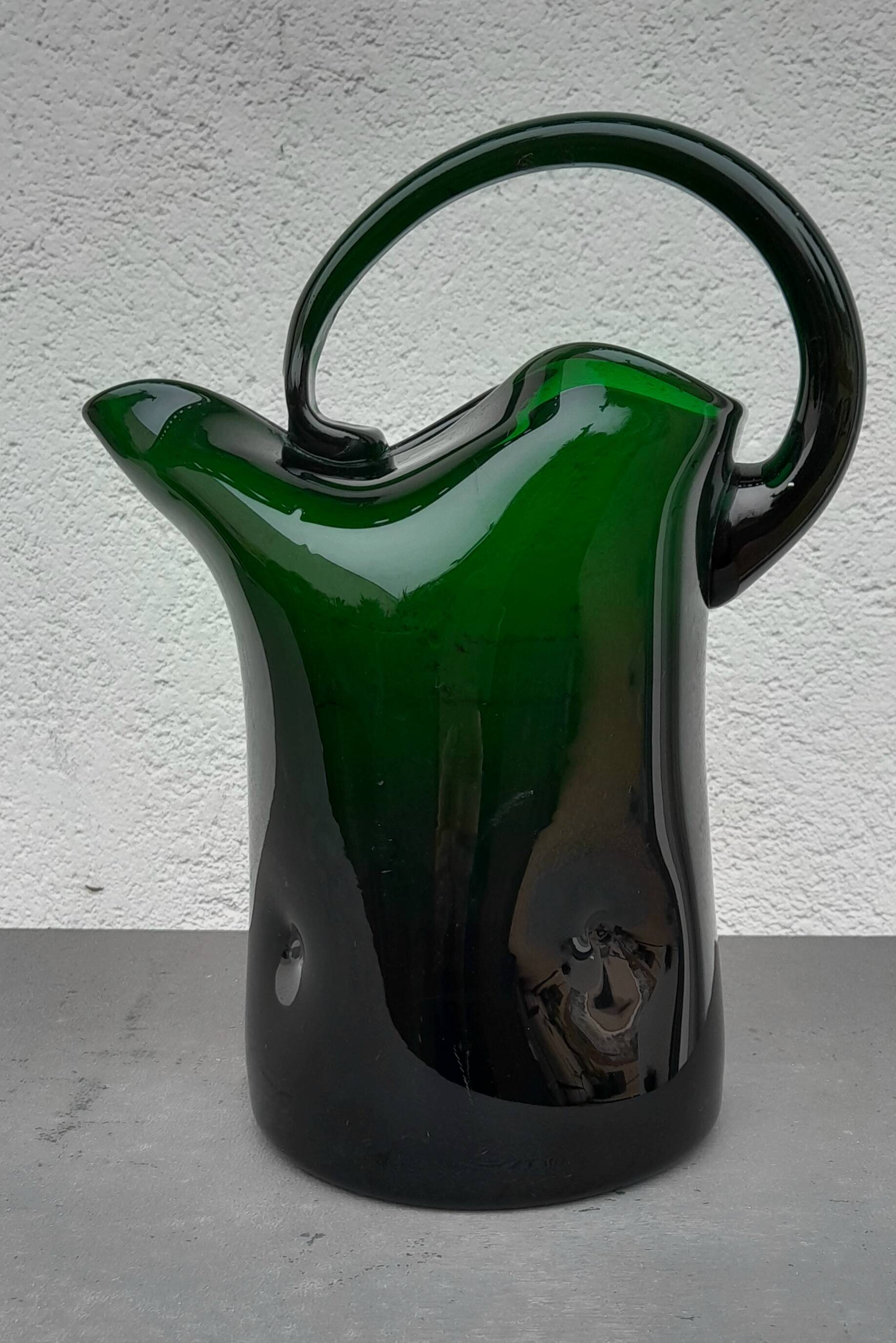 Blown glass pitcher filled
