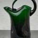 Blown glass pitcher filled