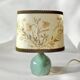 Old small green ceramic side lamp with dried flower lampshade
