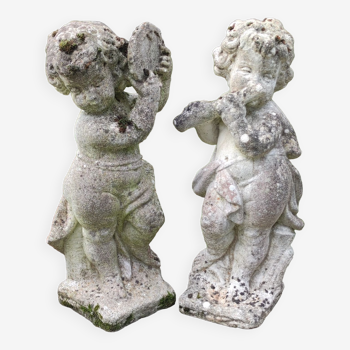 Pair cherub statues in reconstituted stone