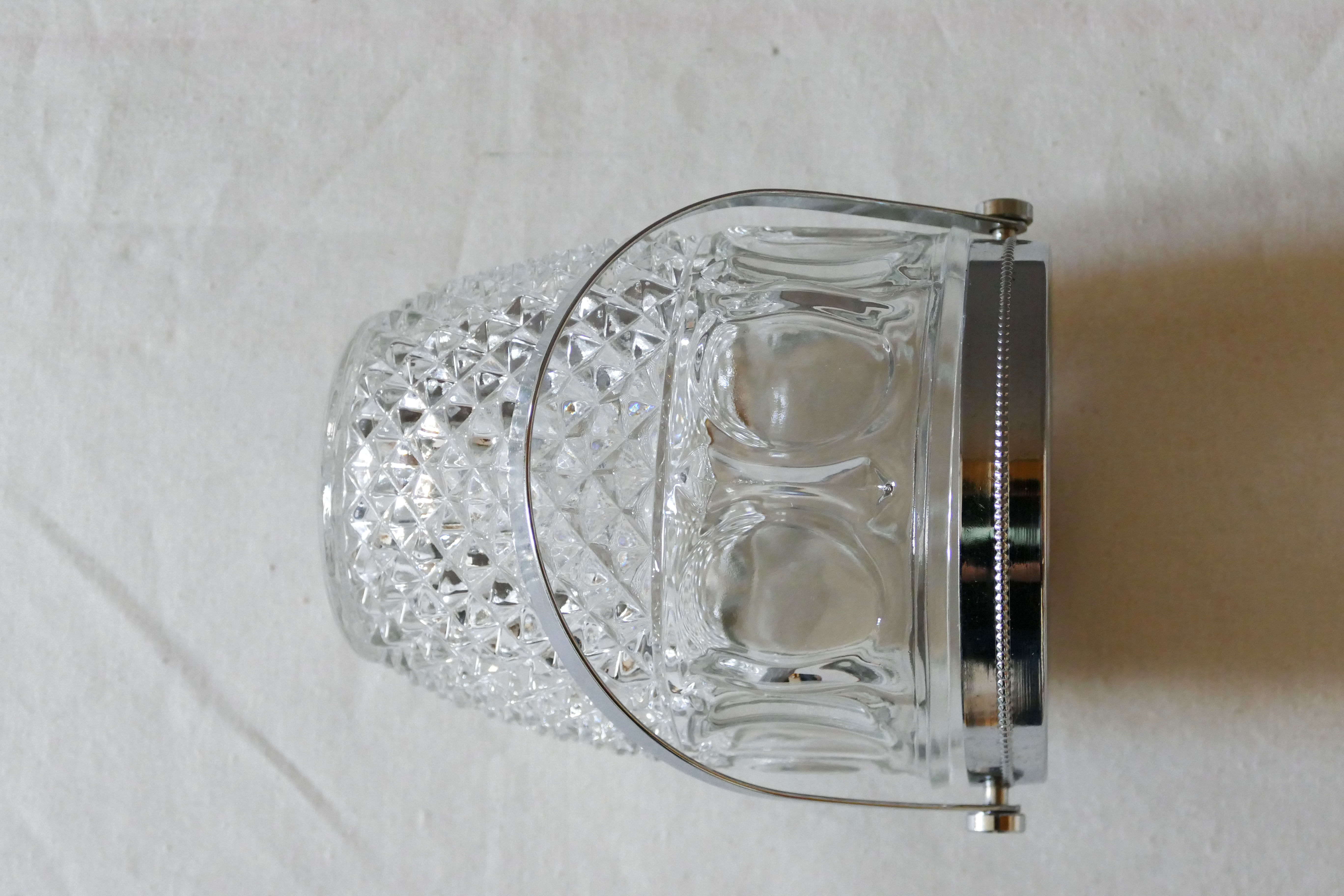 Vintage glass ice bucket stamped with a metal handle