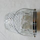 Vintage glass ice bucket stamped with a metal handle