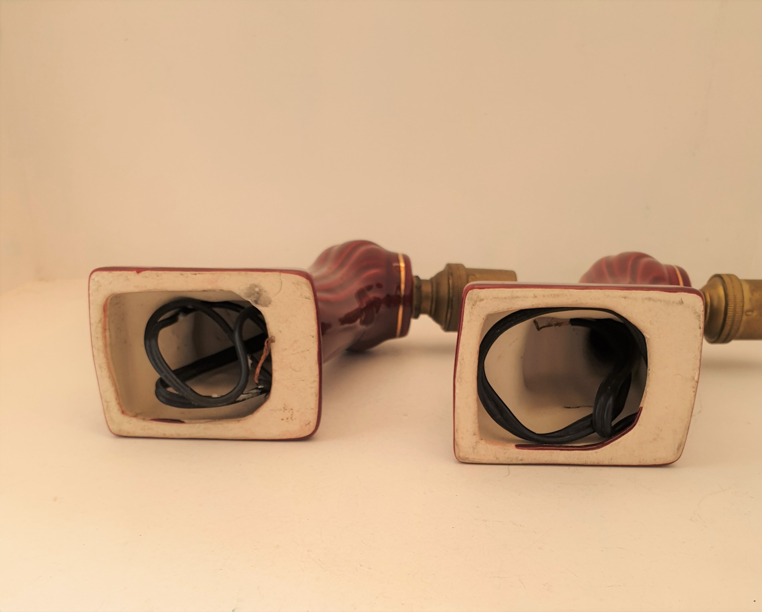 Pair of art deco sconces in bordeaux and gold ceramics