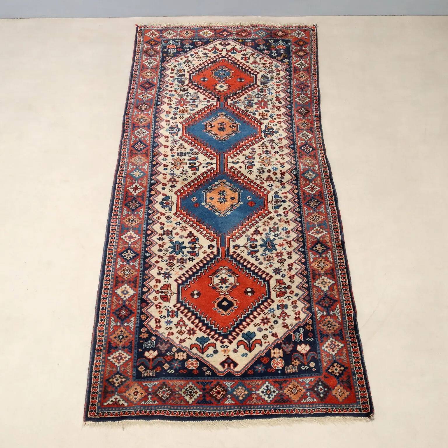 Ancient Asian wool rug, finely knotted, handmade 72 x 33 in.