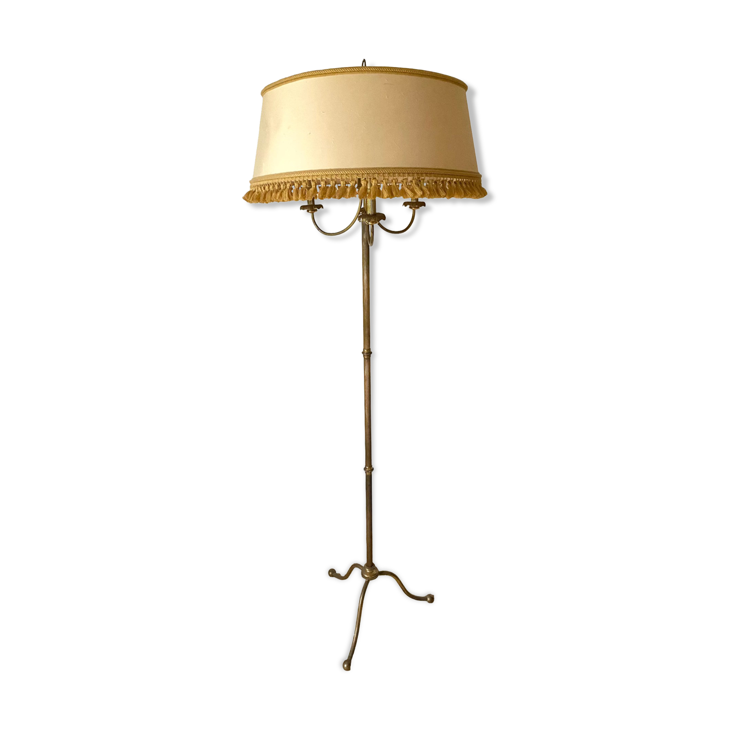 Three-light tripod floor lamp in gilded brass.