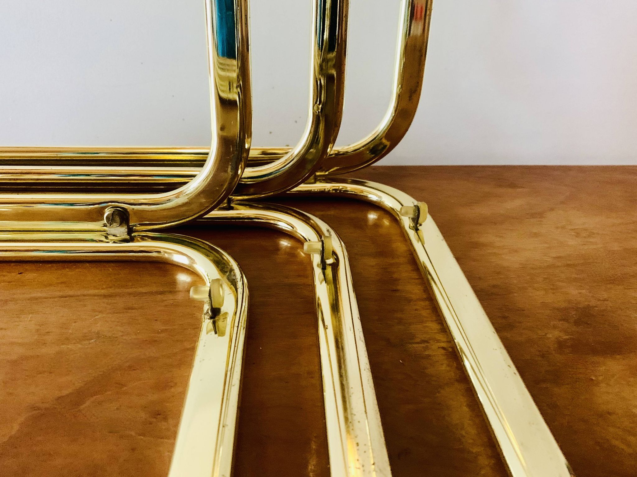 Vintage nesting tables in gold metal and smoked glass