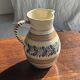 Beige carafe with stylized blue flower friezes