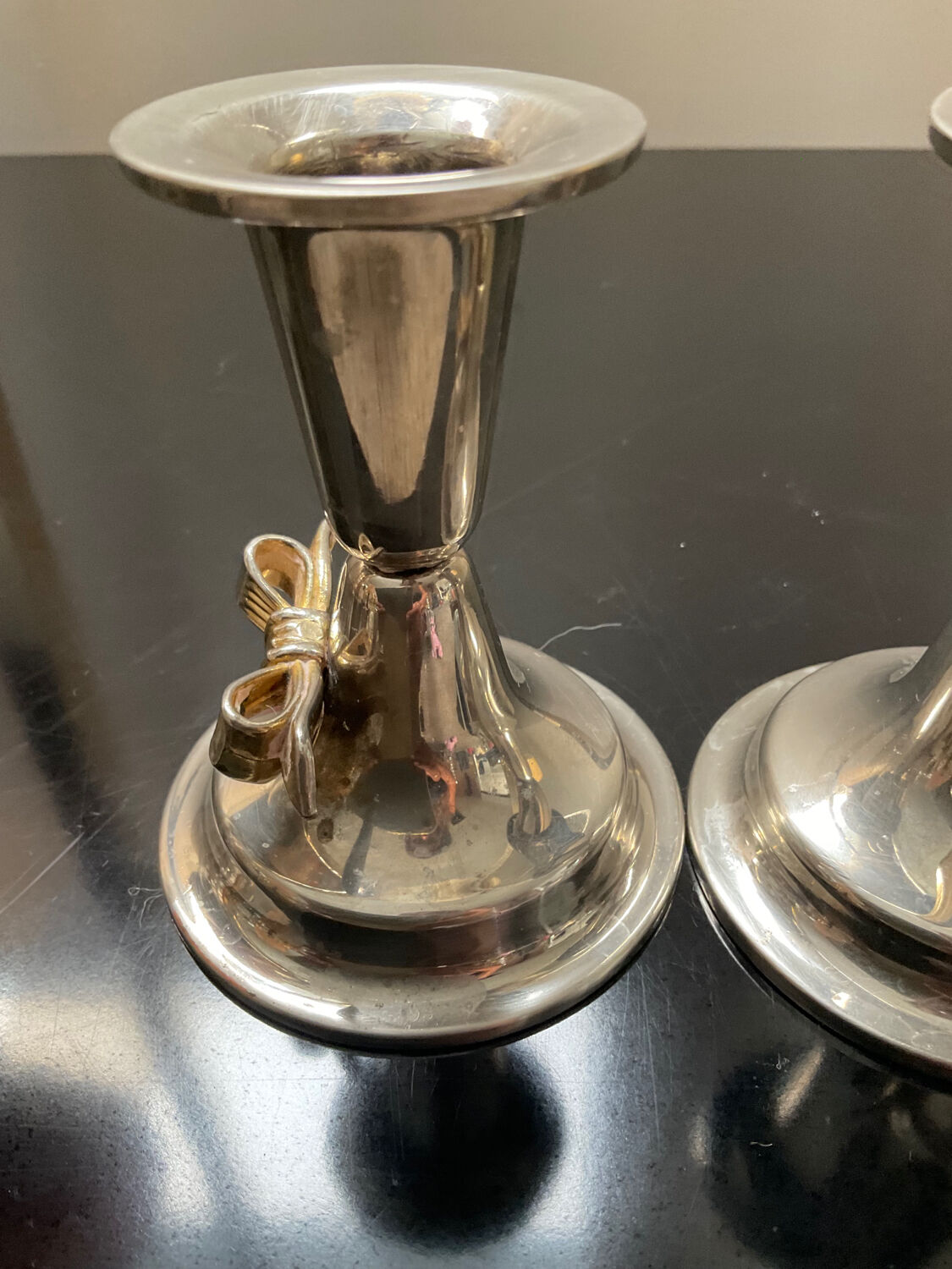 Pair of vintage candle holders in silver metal and brass