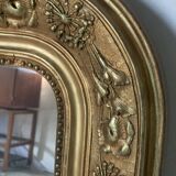 Golden fireplace mirror with pediment