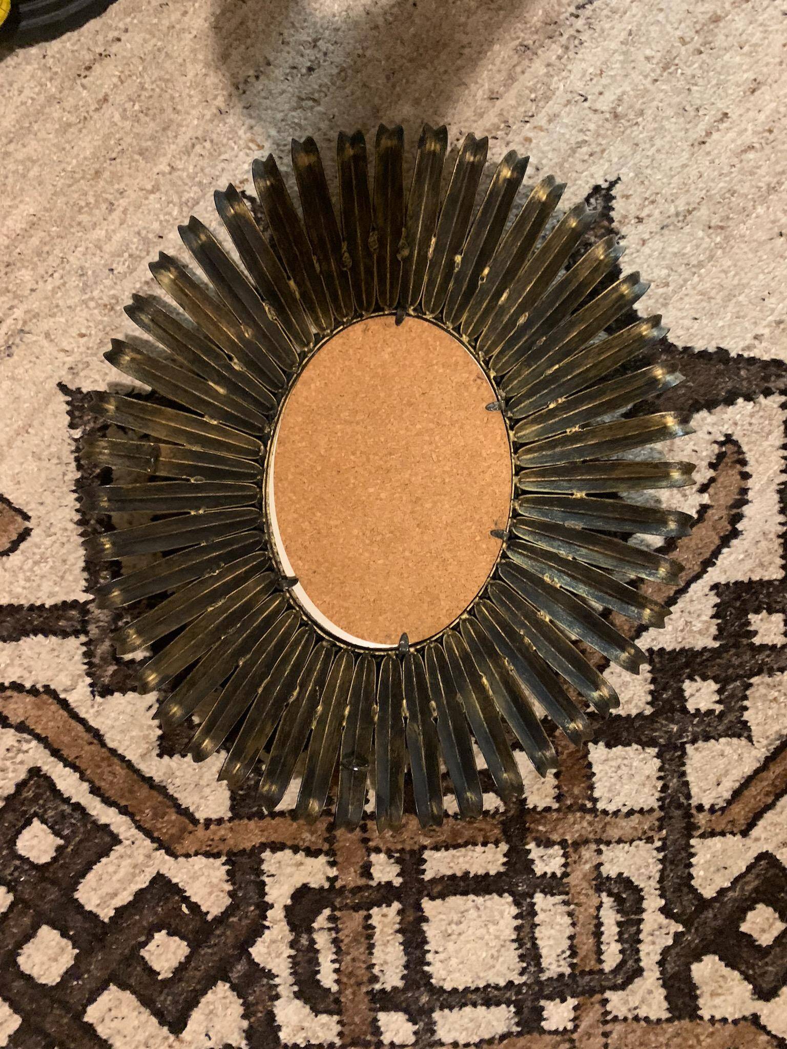 Golden iron star-shaped mirror, mid-1900s.