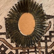Golden iron star-shaped mirror, mid-1900s.