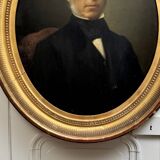 Oil on canvas portrait of a man, late 19th century, oval frame gilded with gold leaf.