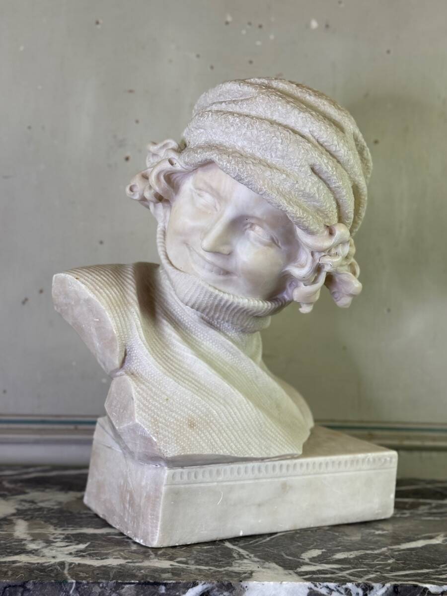 Alabaster bust of a young girl with a turtleneck, signed Caloni, Italy circa 1900