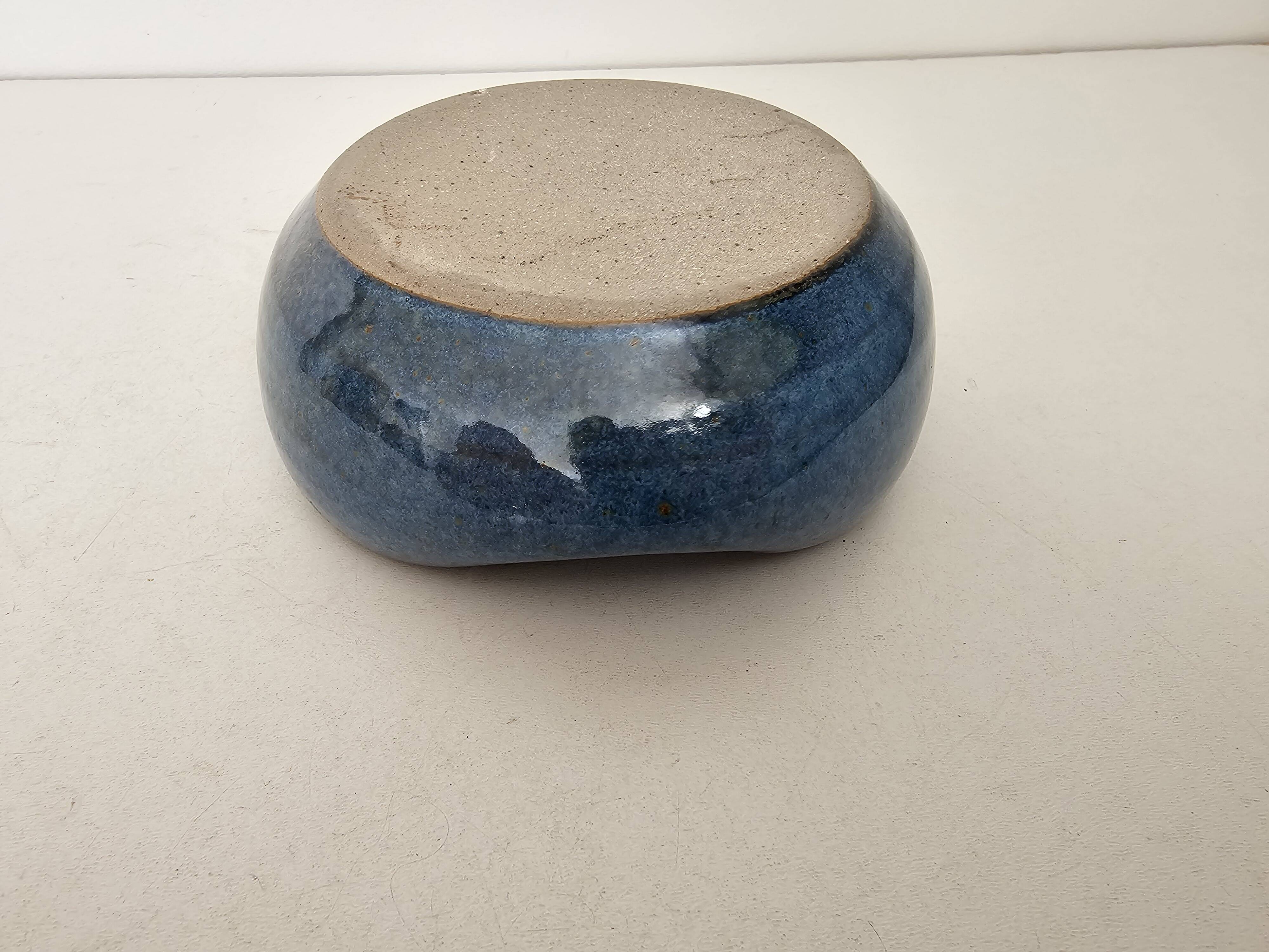 Blue ceramic catchall ashtray in a free form, signed CH.