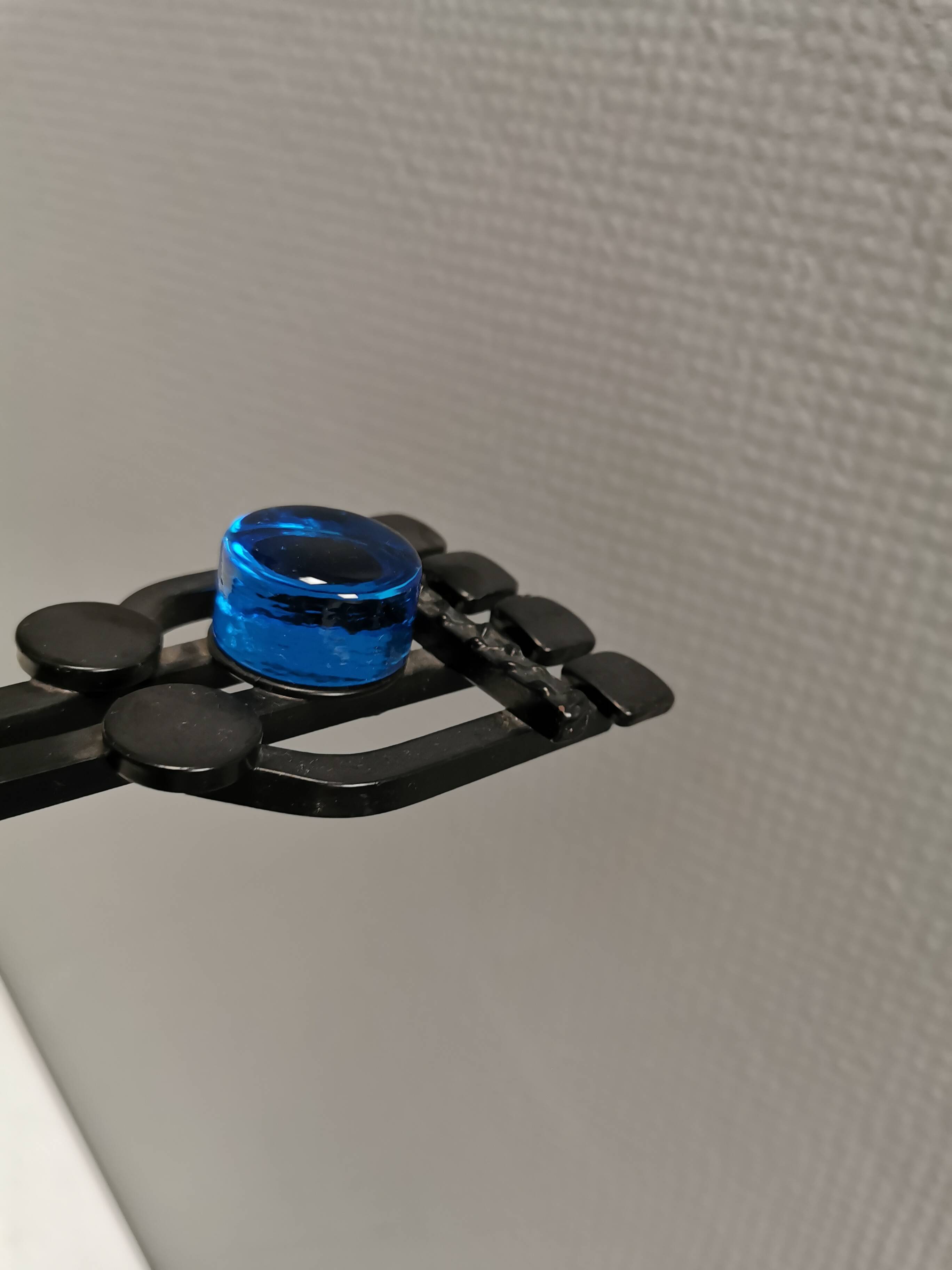 Vintage wall candle holder in wrought iron and hard pressed blue glass.