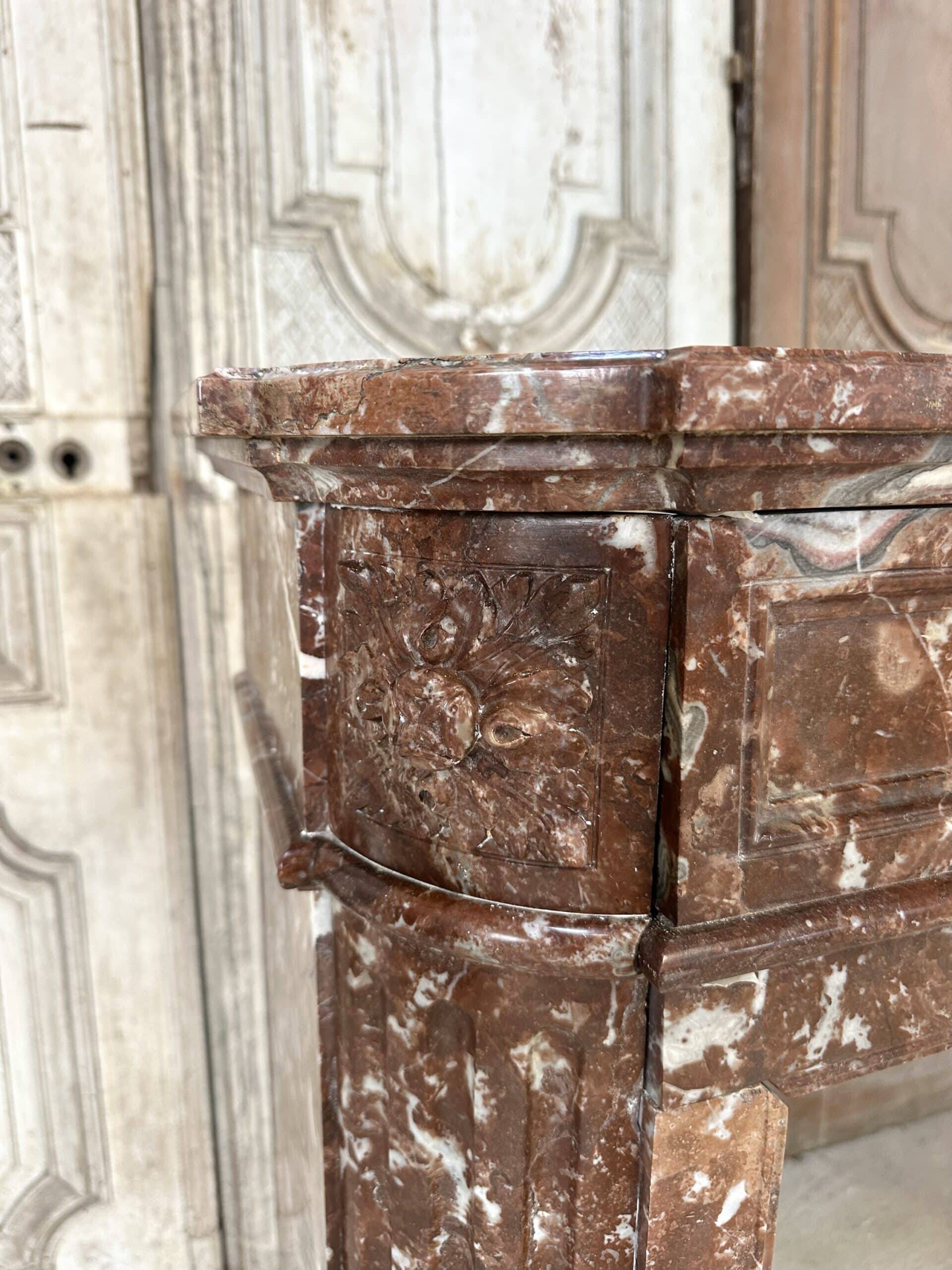 Red marble fireplace in the Louis XVI style, late 19th century