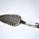 Vintage silver-plated pie server with rose decoration.