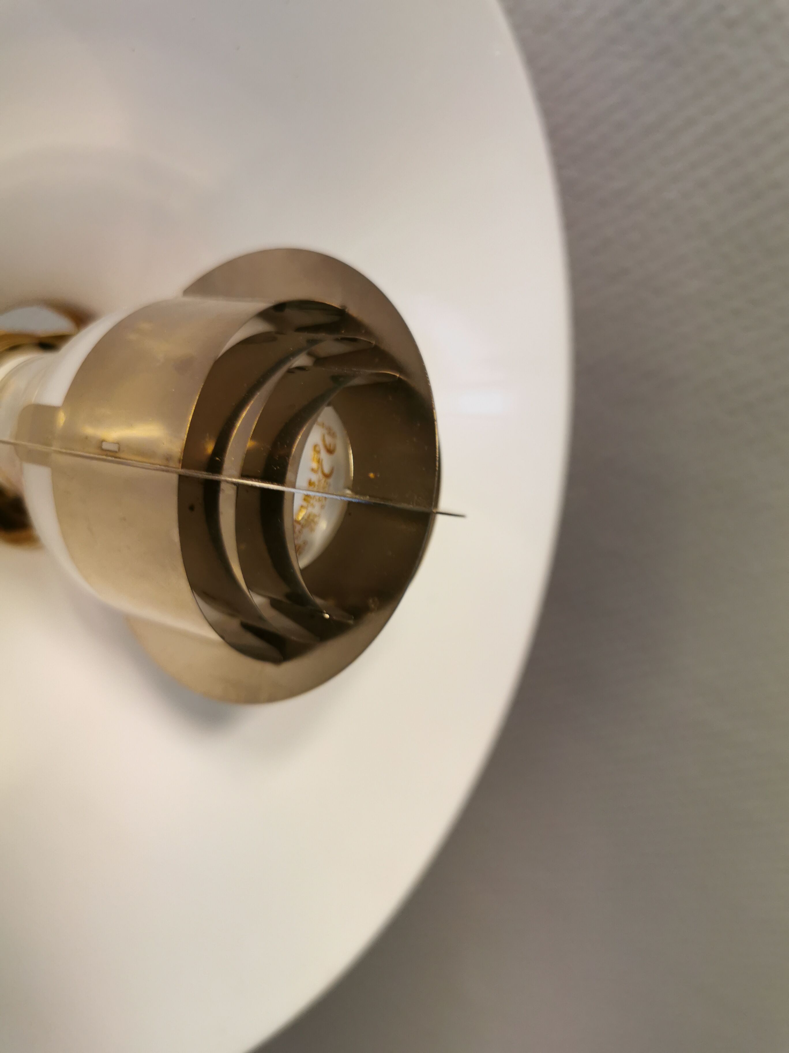 Copper hanging lamp with brass colored top and white inside lacquer.