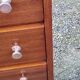 Vintage golden oak chest of drawers with 4 spindle feet from the 1950s