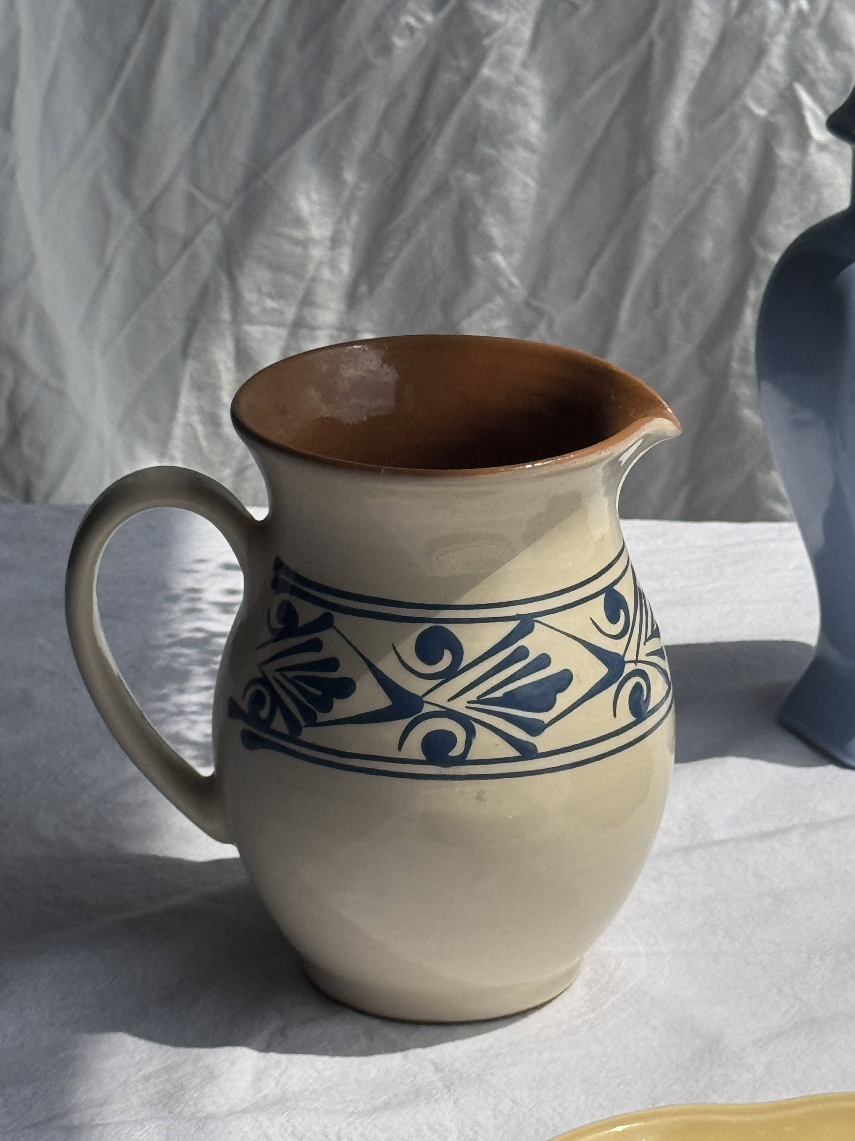 Vintage white pitcher with stylized blue plant frieze H17.5