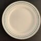 8 flat plates in opaque porcelain from Gien Terre de Fer, model Lauriers, XXth