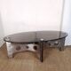 Table basse design vintage en alu brossé et plateau de verre.