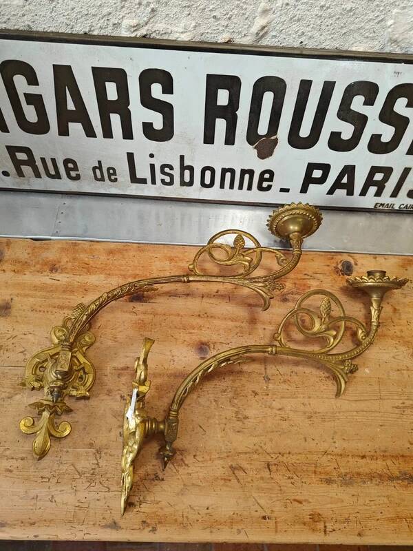 Set of two large antique brass candle wall sconces.