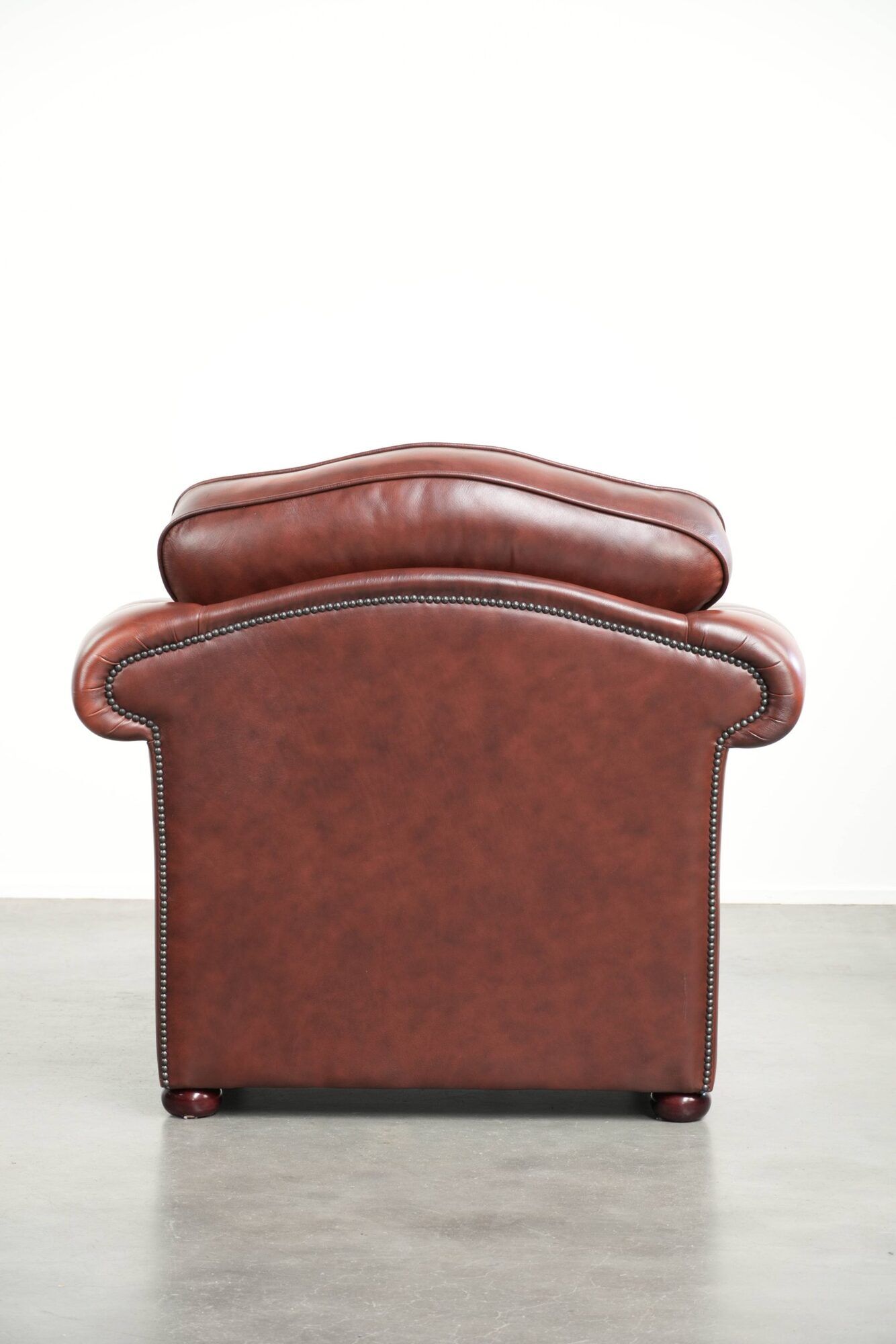 Brown cow leather Chesterfield armchair in a unique design