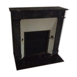 White veined black marble fireplace