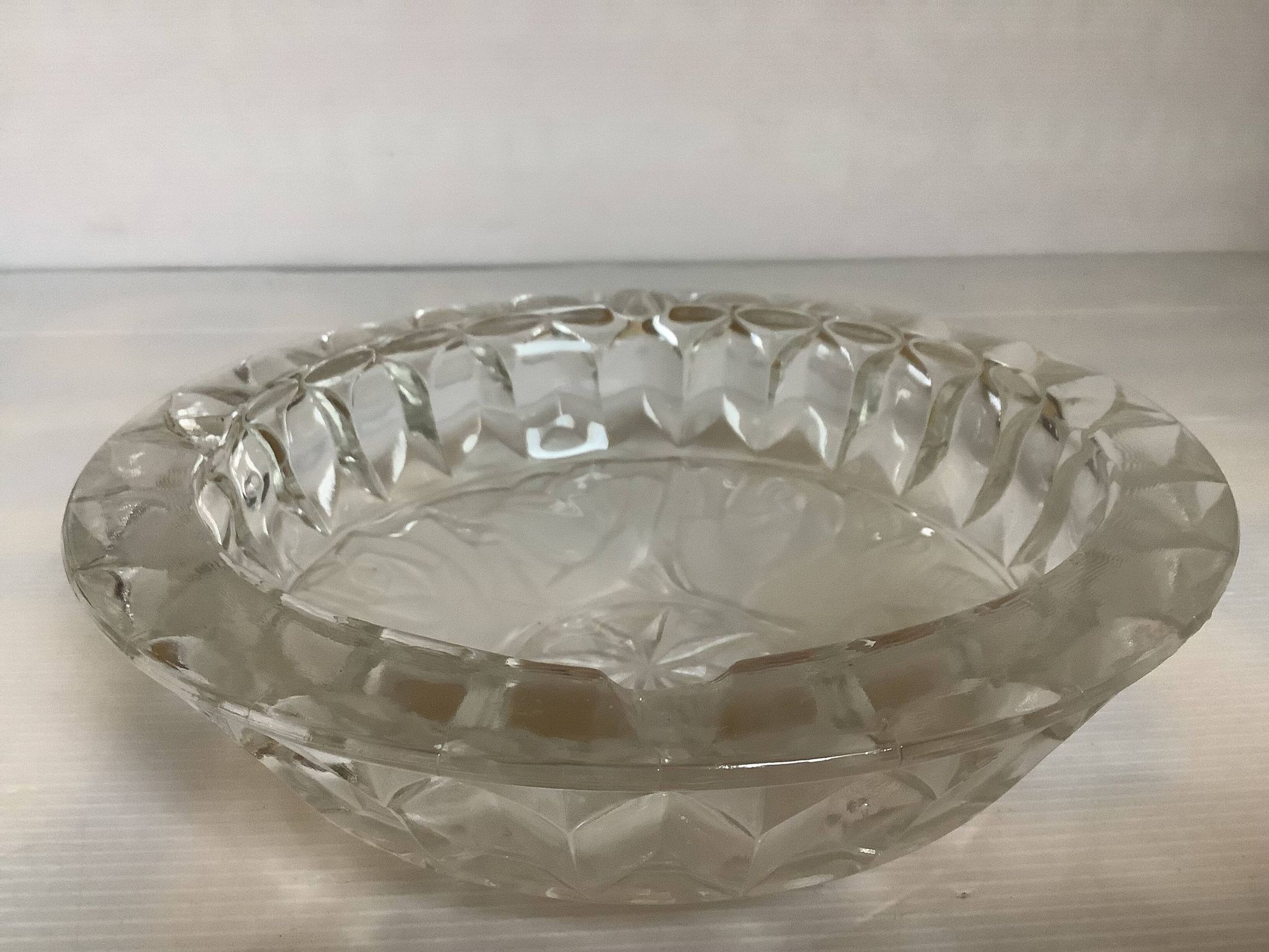 Large glass ashtray with frosted flowers.