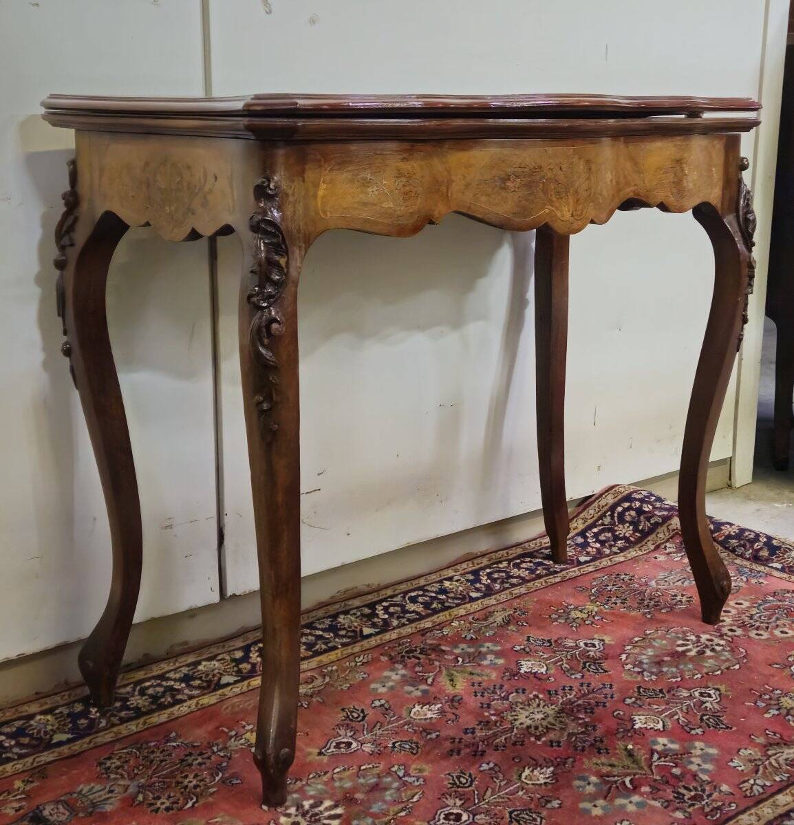 Louis XV style game table in marquetry and mahogany.