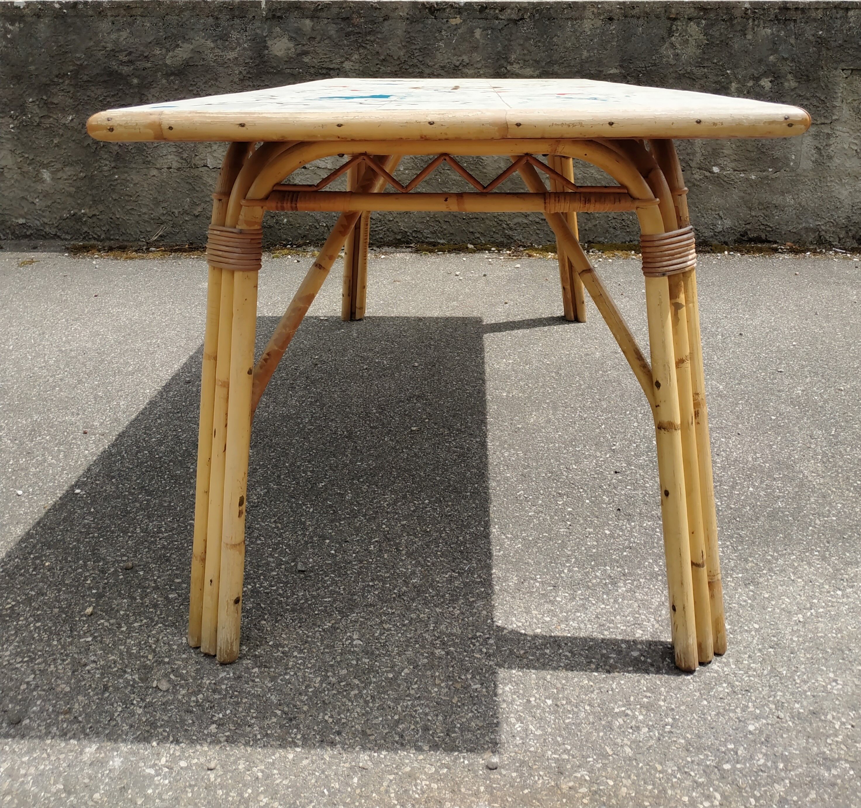 Vintage table in rattan Audoux and Minnet and ceramics Chassin 1950