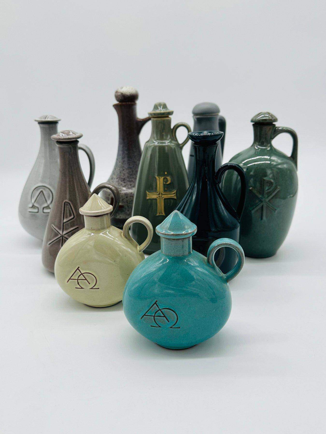 Set of nine modern sculptural ceramic vases from the mid-century, Bauhaus influence.