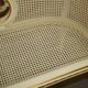 Louis XV window bench embroidered in gold and silver leaf.