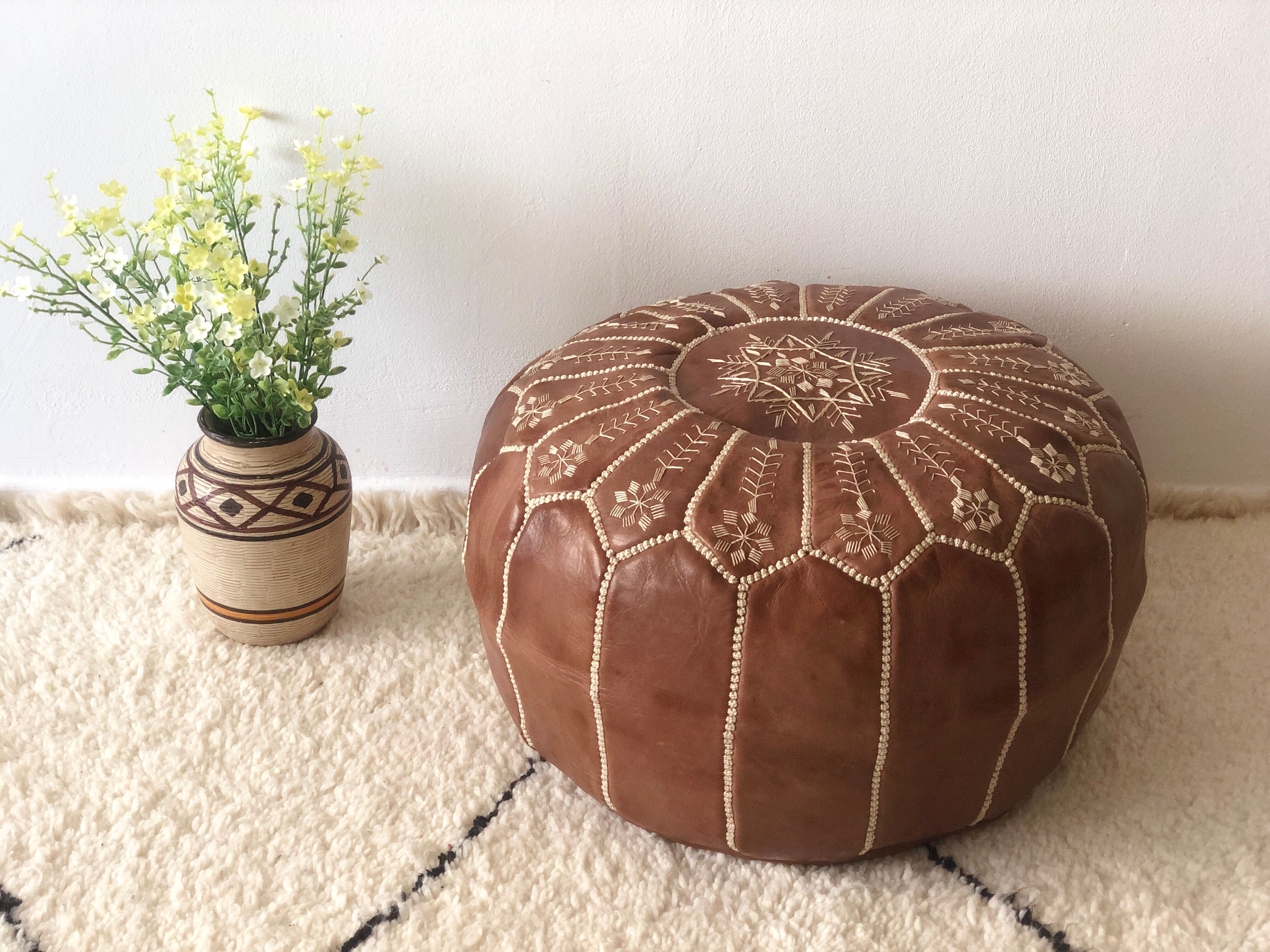 Moroccan-style brown leather pouf