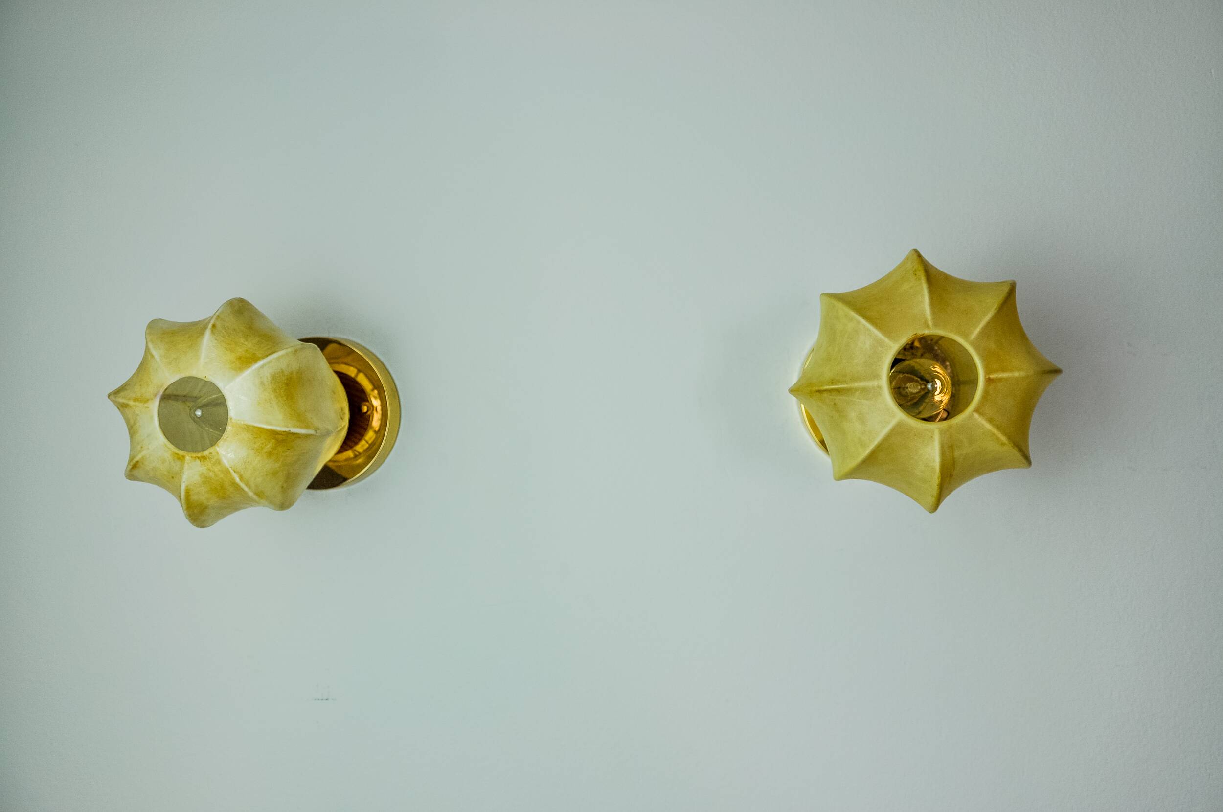 Pair of "cocoon" wall lights, resin and pine, Italy, 1970