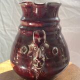Oxblood pitcher with grotesque mask in the Delplera spirit