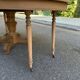 Round dining table with a central pedestal, stripped raw oak, 4 extensions, 19th century.