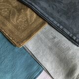 Suite of four tinted antique napkins
