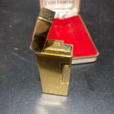 Lighter with its golden box