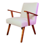Vintage beige bouclé armchair with walnut wood from the 1950s.