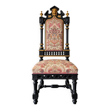 Historicist chair in ebonised and gilded wood