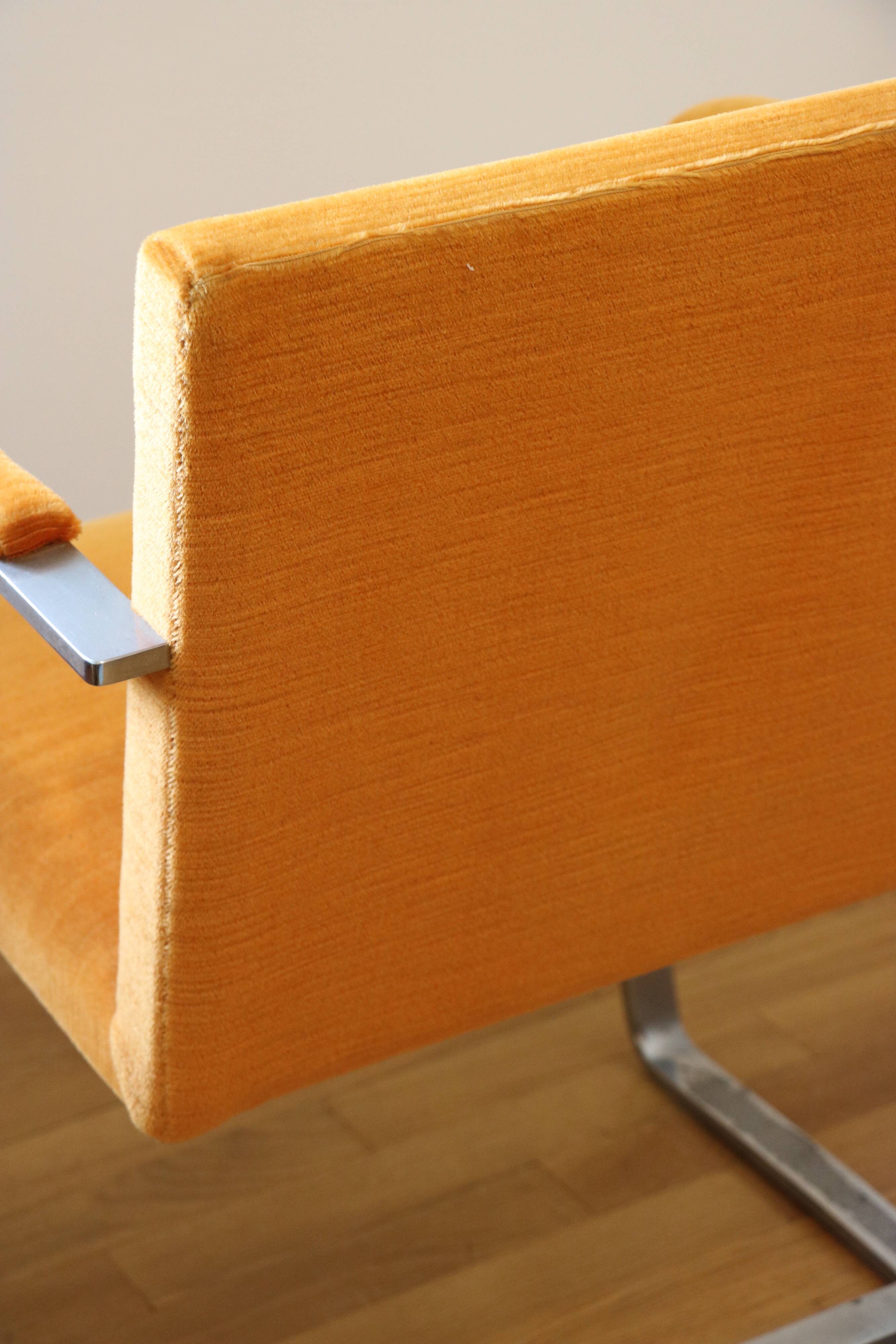 Chrome-plated metal and orange fabric armchair, 1970